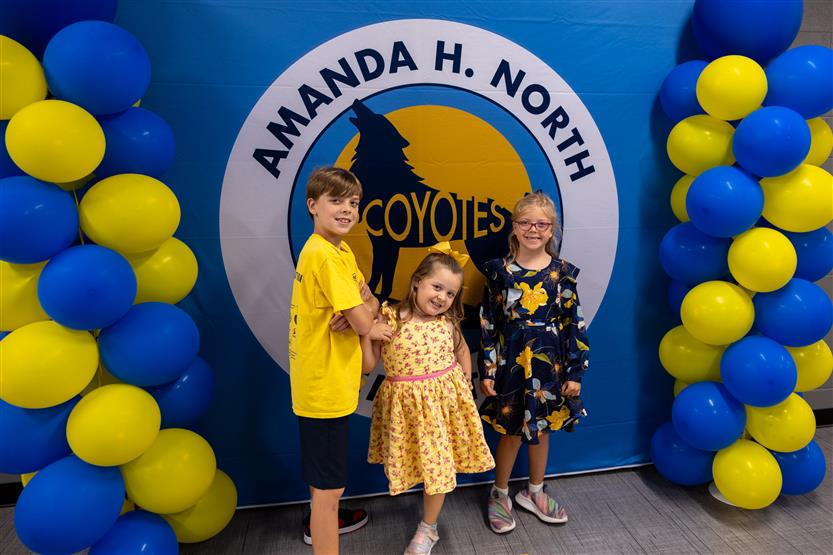 Students cut ribbon at new school